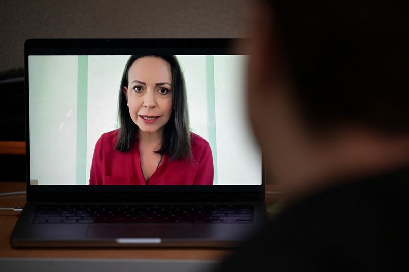 © Reuters. Venezuela's opposition leader Maria Corina Machado is seen on a laptop screen during a virtual press conference with foreign media, in Caracas, Venezuela, September 5, 2024. REUTERS/Gaby Oraa