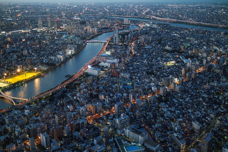 © Reuters. Office and residential buildings are seen from the observation deck of Tokyo Skytree, the world's tallest broadcasting tower, in Tokyo, Japan, August 18, 2021. REUTERS/Marko Djurica/File Photo