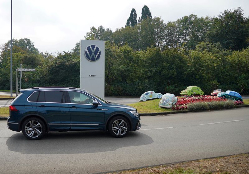 &copy; Reuters. FILE PHOTO: A vehicle drives near the Baunatal Volkswagen site, the day when Volkswagen's works council holds a regular meeting with workers in Germany to discuss matters including progress on its cost-cutting drive, in Baunatal, Germany, September 4, 202