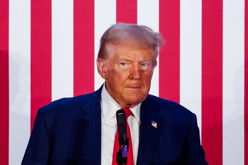 © Reuters. FILE PHOTO: Republican presidential nominee and former U.S. President Donald Trump looks on as he addresses the Fraternal Order of Police at their meeting in Charlotte, North Carolina, U.S. September 6, 2024. REUTERS/Jonathan Drake/File Photo