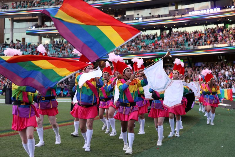 &copy; Reuters. FILE PHOTO: Participants celebrate the Sydney Gay and Lesbian Mardi Gras Parade under coronavirus disease (COVID-19) safety guidelines at the Sydney Cricket Ground in Sydney, Australia, March 6, 2021.  REUTERS/Loren Elliott/File Photo