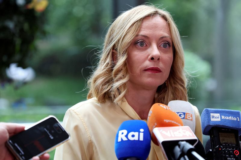 © Reuters. Italian Prime Minister Giorgia Meloni listens to a question as she speaks to members of the media in Beijing, China July 30, 2024. REUTERS/Florence Lo/File Photo