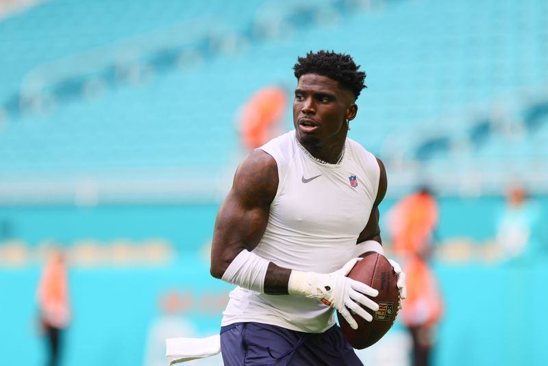 © Reuters. Aug 17, 2024; Miami Gardens, Florida, USA; Miami Dolphins wide receiver Tyreek Hill (10) throws the football before preseason game against the Washington Commanders at Hard Rock Stadium. Mandatory Credit: Sam Navarro-USA TODAY Sports/ File Photo