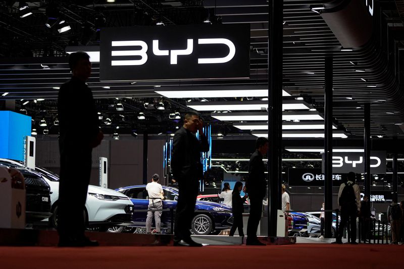 &copy; Reuters. FILE PHOTO: Security guards stand at the BYD booth at the Auto Shanghai show, in Shanghai, China April 19, 2023. REUTERS/Aly Song/File Photo