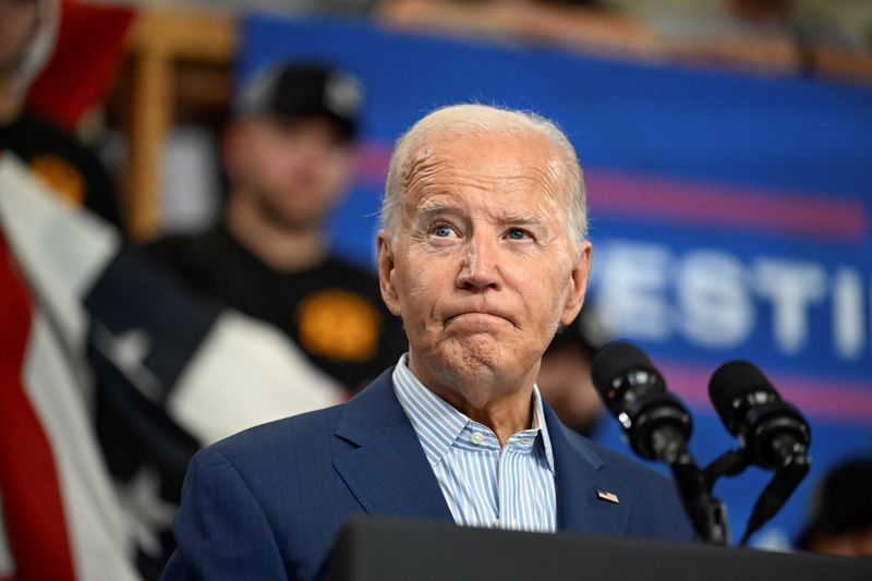 &copy; Reuters. FILE PHOTO: U.S. President Joe Biden reacts as he delivers remarks during a visit to the United Association Local 190 Training Center in Ann Arbor, Michigan, U.S., September 6, 2024. REUTERS/Craig Hudson/File Photo