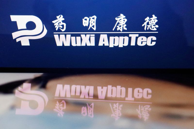 &copy; Reuters. FILE PHOTO: The logo of Chinese drug research and development group WuXi AppTec is displayed alongside its company website, in this illustration picture taken February 5, 2024. REUTERS/Florence Lo/Illustration/File Photo