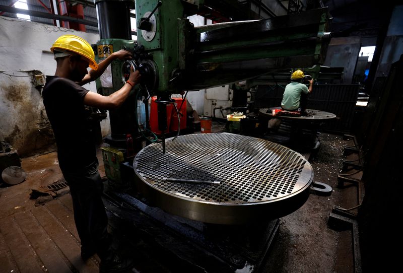 &copy; Reuters. FILE PHOTO: A worker makes a metal filter plate inside an industrial manufacturing unit on the outskirts of Ahmedabad, India, July 23, 2024. REUTERS/Amit Dave/File Photo/