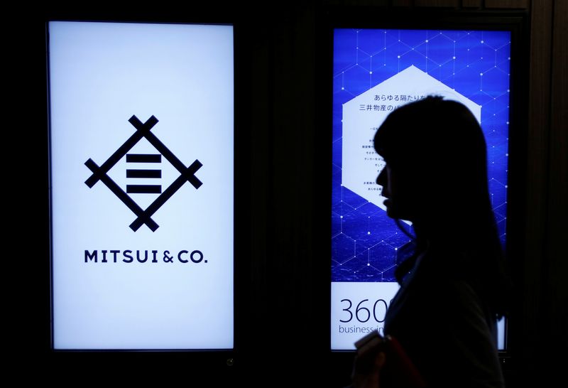 © Reuters. A woman walks past the logo of Japanese trading company Mitsui & Co. in Tokyo, Japan, February 8, 2017.    REUTERS/Toru Hanai/File Photo