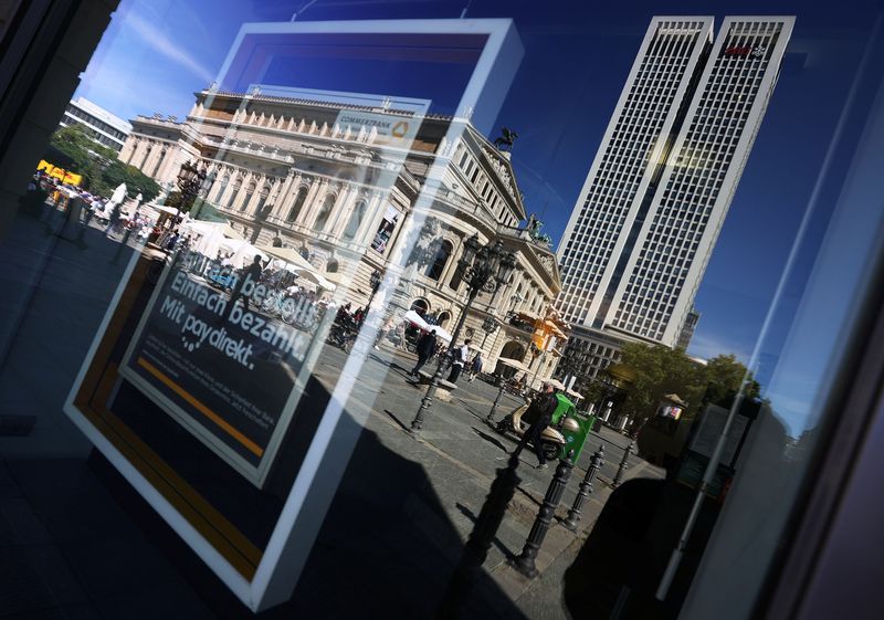 &copy; Reuters. FILE PHOTO: The branch of Swiss bank UBS is reflected in the window of a branch of Germany's Commerzbank next to the old opera house in Frankfurt, Germany, September 8, 2020, REUTERS/Kai Pfaffenbach/File Photo