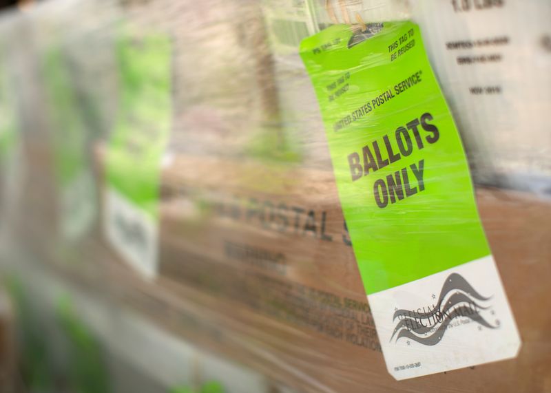 © Reuters. FILE PHOTO: Mail-in ballots are shown at the Orange County Registrar of voters before being sent to the U.S. Postal Service for delivery to voters in Santa Ana, California, U.S., October 5, 2020. REUTERS/Mike Blake/File Photo