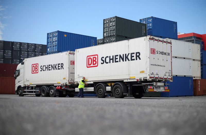 © Reuters. ARCHIVE PHOTO: DB Schenker trucks are seen during a press tour of Deutsche Bahn Schenker's logistics unit at the Port of Hamburg, Germany, August 8, 2024. REUTERS/Cathrin Mueller/File photo