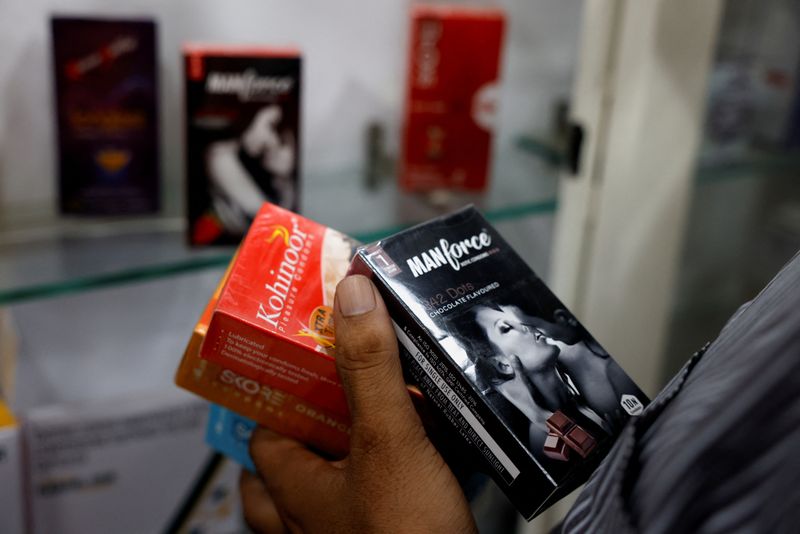 &copy; Reuters. FILE PHOTO: A man selects packets of condoms that are displayed for sale at a chemist shop in Ahmedabad, India, September 2, 2024. REUTERS/Amit Dave/File Photo