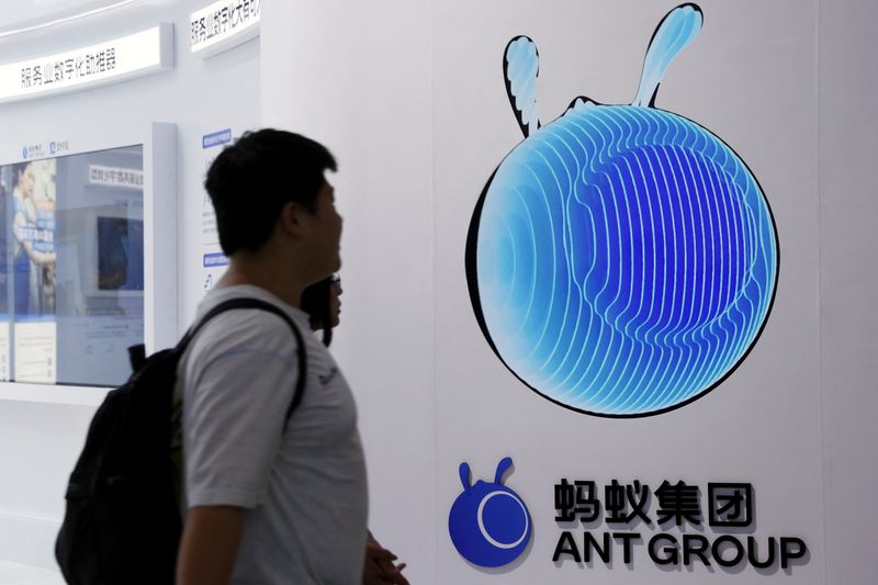 &copy; Reuters. FILE PHOTO: People walk past the Ant Group logo at its booth at the China International Fair for Trade in Services (CIFTIS) in Beijing, China September 2, 2023. REUTERS/Florence Lo/file photo