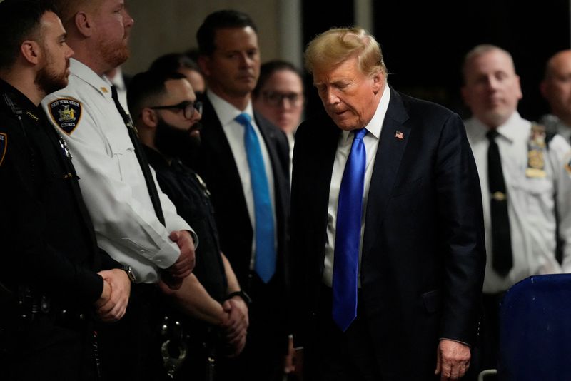 &copy; Reuters. Former President Donald Trump walks to make comments to members of the media after being found guilty on 34 felony counts of falsifying business records in the first degree at Manhattan Criminal Court, Thursday, May 30, 2024, in New York.   Seth Wenig/Poo