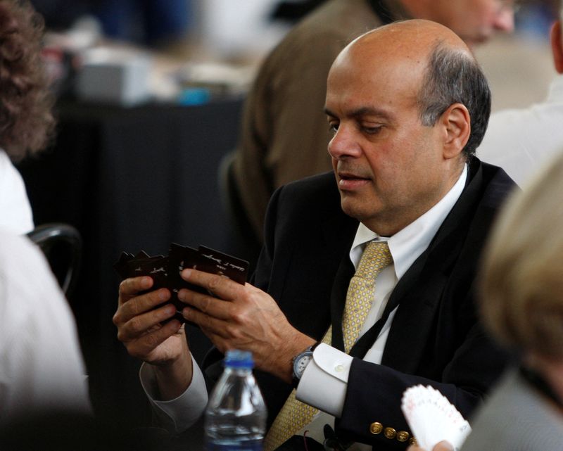 &copy; Reuters. FILE PHOTO: Ajit Jain, who runs some of Berkshire's insurance operations, plays a game of bridge during Berkshire Hathaway Shareholders annual meeting in Omaha, Nebraska May 3, 2009. REUTERS/Carlos Barria (UNITED STATES BUSINESS)/File Photo