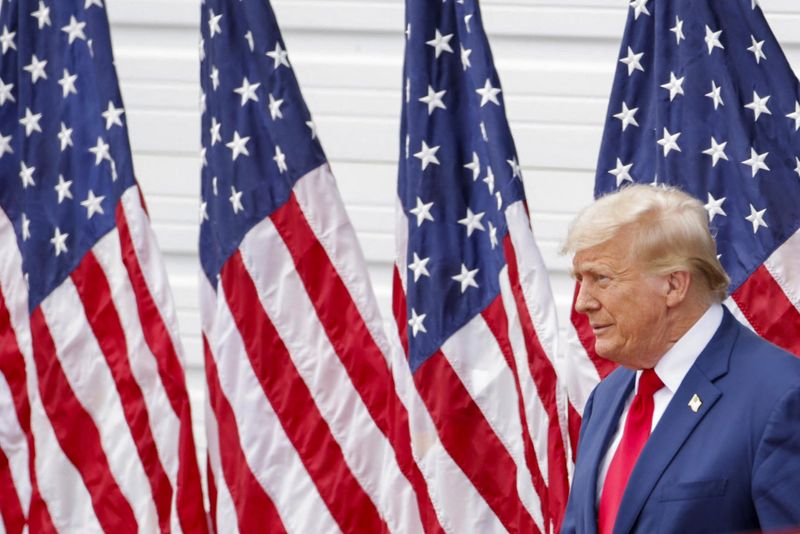 &copy; Reuters. FILE PHOTO: Republican presidential nominee and former U.S. President Donald Trump looks on during a campaign rally, at the North Carolina Aviation Museum & Hall of Fame in Asheboro, North Carolina, U.S. August 21, 2024. REUTERS/Jonathan Drake/File Photo