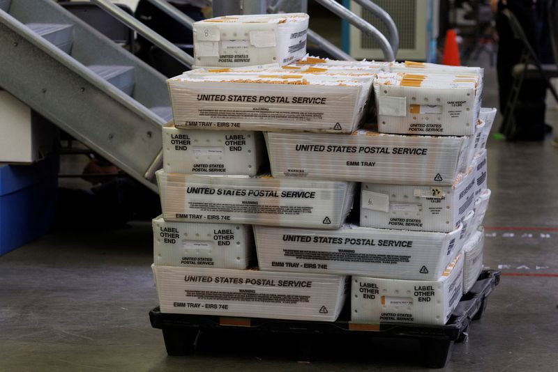 &copy; Reuters. Mail-in ballots sit waiting to be processed at the Orange County Registrar of Voters during a media tour showing ballot security at the facility, in Santa Ana, California, U.S., November 1, 2022.    REUTERS/Mike Blake/File Photo