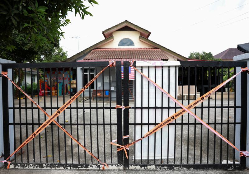 © Reuters. A view of the entrance of a site sealed off by Malaysia's Department of Social Welfare following a raid, in Subang, Malaysia September 14, 2024. REUTERS/Hasnoor Hussain/File Photo