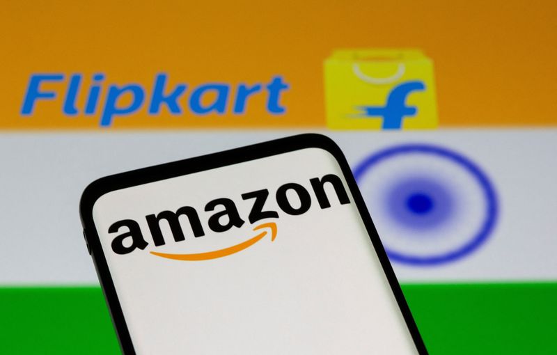 © Reuters. FILE PHOTO: Smartphone with Amazon logo is seen in front of Flipkart logo displayed and Indian flag in this illustration taken July 30, 2021. REUTERS/Dado Ruvic/Illustration/File Photo