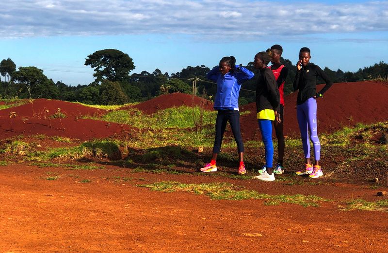 © Reuters. Women athletes take a break after attending a training session in the Rift Valley town of Iten, in Elgeyo-Marakwet County, Kenya September 9, 2024. REUTERS/Mukelwa Hlatshwayo