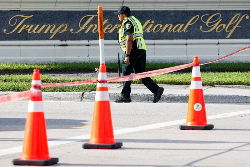 &copy; Reuters. A law enforcement officer walks after reports of shots fired outside Republican presidential nominee and former U.S. President Donald Trump's Trump International Golf Course in West Palm Beach, Florida, U.S. September 15, 2024. REUTERS/Marco Bello 