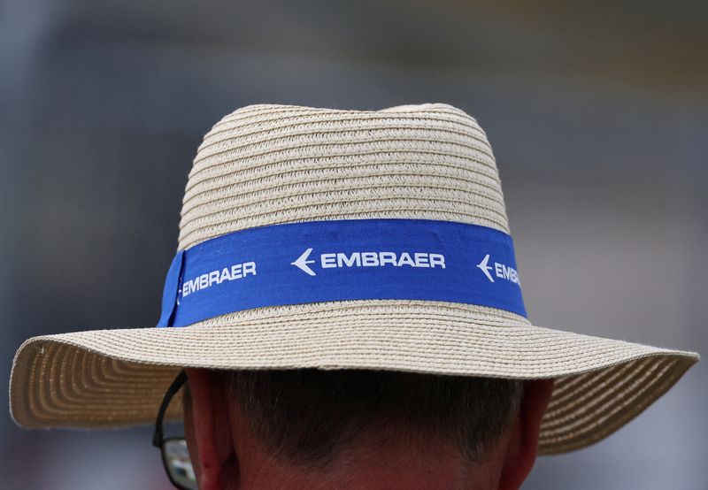 &copy; Reuters. FILE PHOTO: Branding for Embraer is seen on a hat of an attendee at the Farnborough International Airshow, in Farnborough, Britain, July 24, 2024. REUTERS/Toby Melville/File Photo