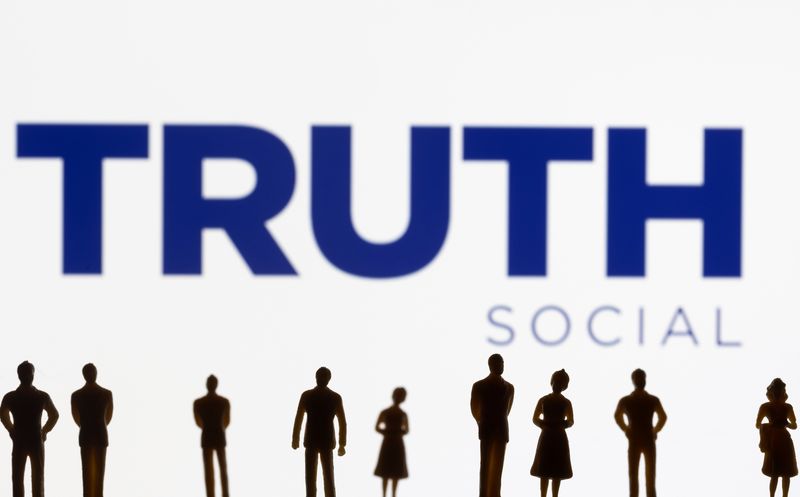 &copy; Reuters. FILE PHOTO: The Truth social network logo is seen displayed behind figurines in this picture illustration taken February 21, 2022. REUTERS/Dado Ruvic/Illustration/File Photo