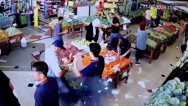 &copy; Reuters. A man's bag explodes in a supermarket in Beirut, Lebanon September 17, 2024 in this screen grab from a video obtained from social media. Social Media/via REUTERS  