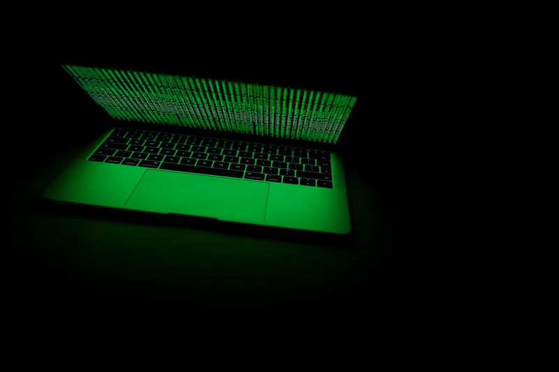 &copy; Reuters. FILE PHOTO: A computer lit by a displayed cyber code is seen in this illustration picture taken on March 1,  2017. REUTERS/Kacper Pempel/Illustration/File Photo