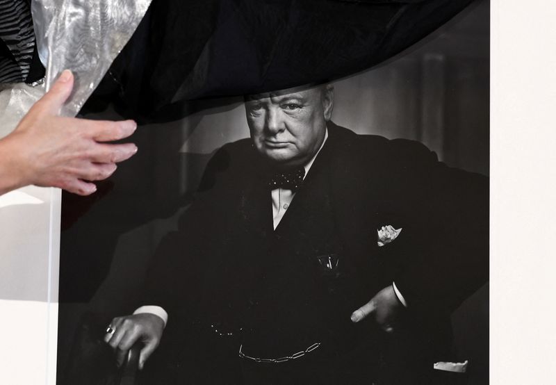 &copy; Reuters. Yousuf Karsh's 'Roaring Lion' portrait of Churchill, stolen in 2022 from Ottawa’s Fairmont Chateau Laurier and recovered in Italy, is unveiled during a ceremony at the Canadian Embassy in Rome, Italy, September 19, 2024. REUTERS/Yara Nardi