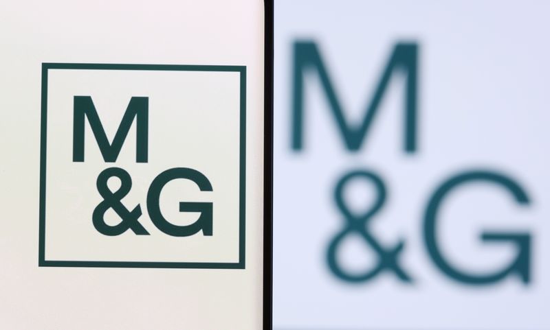 © Reuters. M&G plc logo is seen on a smartphone in front of displayed same logo in this illustration taken, December 1, 2021. REUTERS/Dado Ruvic/Illustration/file photo