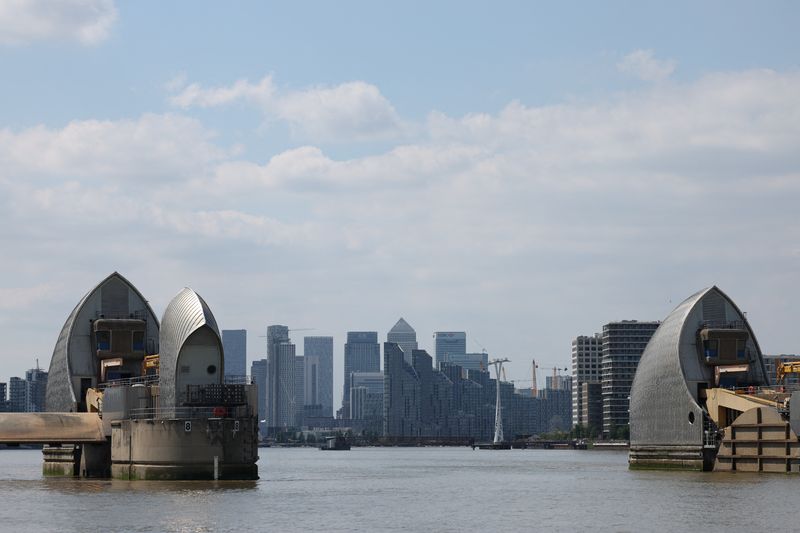 &copy; Reuters. FILE PHOTO: A general view of Canary Wharf office buildings and the Thames Barrier in London, Britain, June 24, 2024. REUTERS/Isabel Infantes/File Photo