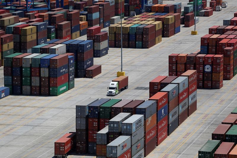 © Reuters. FILE PHOTO: Shipping containers are stacked for storage at Wando Welch Terminal operated by the South Carolina Ports Authority in Mount Pleasant, South Carolina, U.S. May 10, 2018. Picture taken May 10, 2018. REUTERS/Randall Hill/File Photo