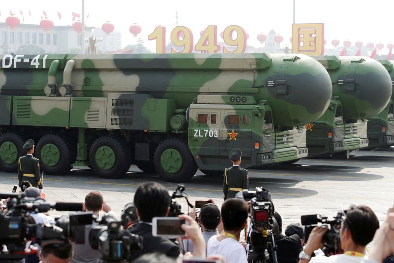 © Reuters. FILE PHOTO: Military vehicles carrying DF-41 intercontinental ballistic missiles travel past Tiananmen Square during the military parade marking the 70th founding anniversary of People's Republic of China, on its National Day in Beijing, China October 1, 2019. REUTERS/Jason Lee/File Photo