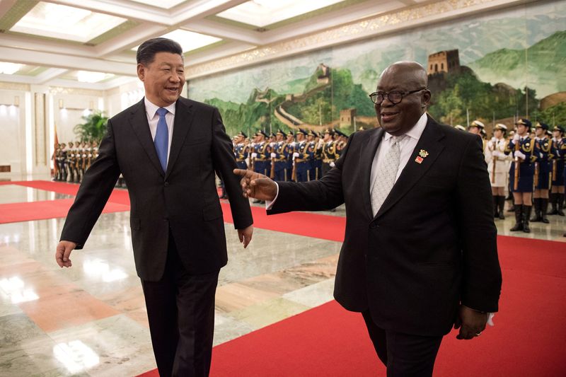 © Reuters. FILE PHOTO: China's President Xi Jinping and Ghana President Nana Akufo-Addo review the Chinese People's Liberation Army honour guard during the welcome ceremony at the Great Hall of the People in Beijing, China September 1, 2018.   Nicolas Asfouri/Pool via REUTERS/File Photo