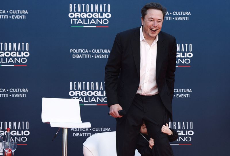 &copy; Reuters. FILE PHOTO: Tesla and SpaceX's CEO Elon Musk reacts, as he attends political festival Atreju organised by Italian Prime Minister Giorgia Meloni's Brothers of Italy (Fratelli d'Italia) right-wing party, in Rome, Italy, December 16, 2023. REUTERS/Guglielmo 