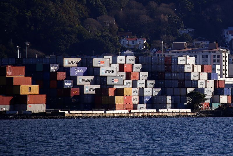 © Reuters. FILE PHOTO: Containers sit stacked at a port terminal with residential houses behind in Wellington, New Zealand, July 2, 2017. REUTERS/David Gray/File Photo