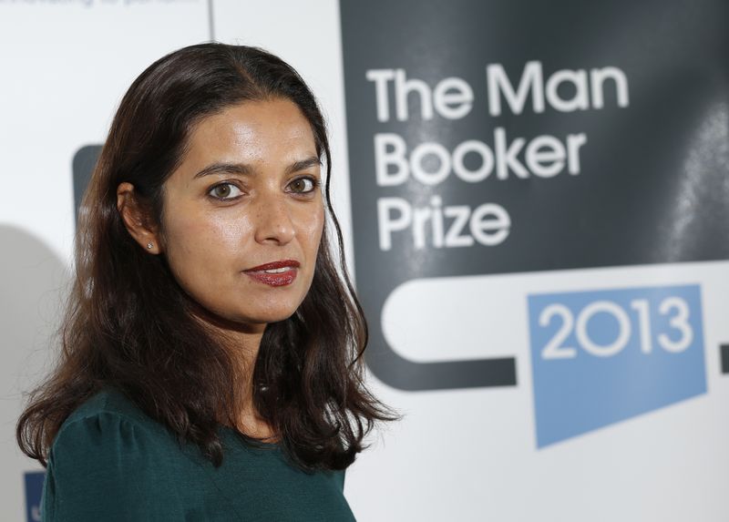 © Reuters. FILE PHOTO: Author Jhumpa Lahiri poses during a photocall at the Southbank Centre in London, October 13, 2013. REUTERS/Olivia Harris/File Photo