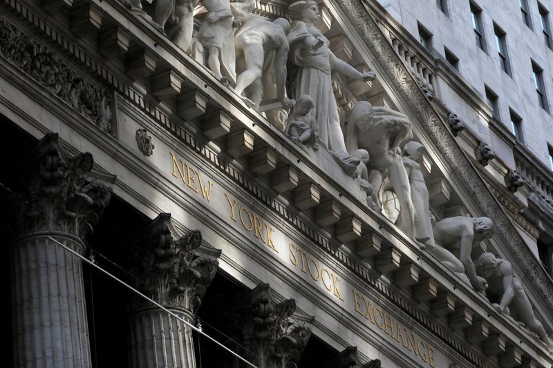 © Reuters. FILE PHOTO: Morning sunlight falls on the facade of the New York Stock Exchange (NYSE) building after the start of Thursday's trading session in Manhattan in New York City, New York, U.S., January 28, 2021. REUTERS/Mike Segar/File Photo