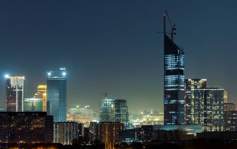 © Reuters. FILE PHOTO: A general view of the city skyline and the National Space Center building under construction at night in Moscow, Russia, September 17, 2024. REUTERS/Maxim Shemetov/File Photo