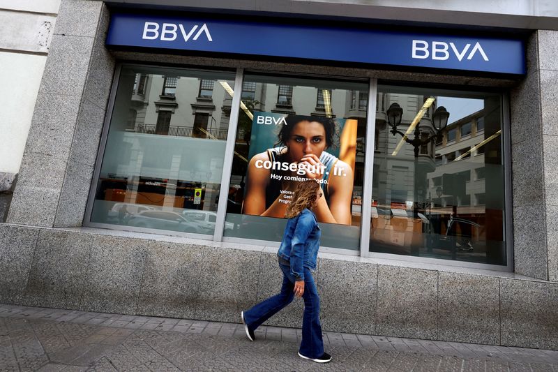 © Reuters. FILE PHOTO: A woman walks past a branch of Spanish bank BBVA in Bilbao, Spain May 13, 2024. REUTERS/Vincent West/File Photo