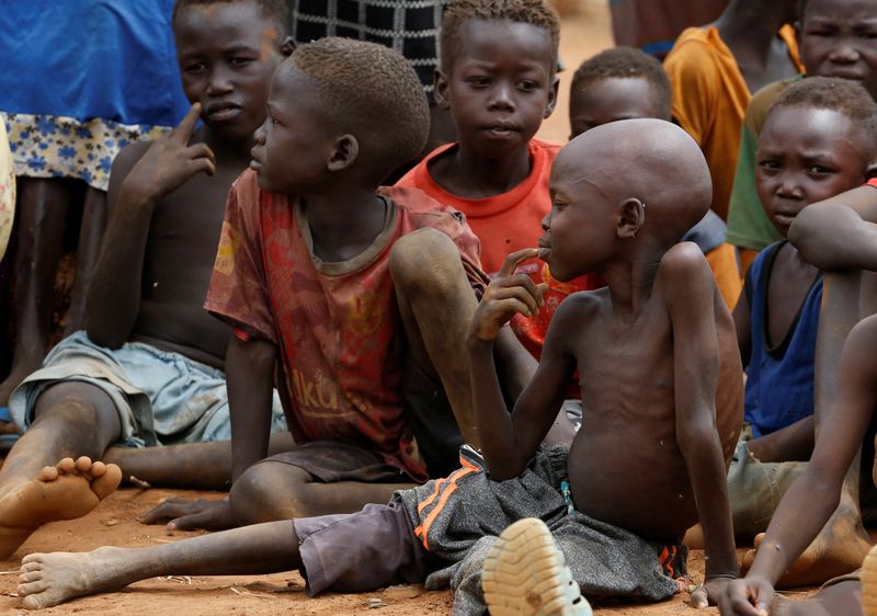 &copy; Reuters. Orphans and children separated from their parents in Kadugli gather to eat boiled leaves for food at an IDP Camp within Sudan People's Liberation Movement-North (SPLM-N) controlled area in Boram County, Nuba Mountains, South Kordofan, Sudan June 22, 2024.