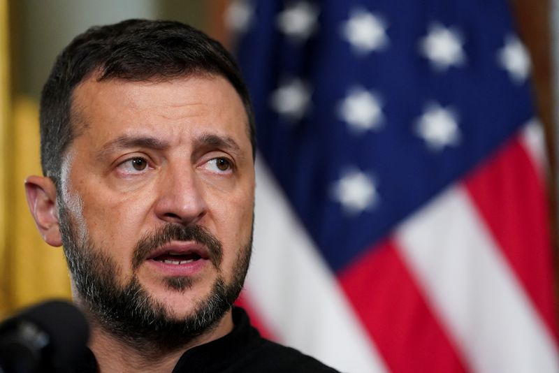 © Reuters. FILE PHOTO: Ukraine's President Volodymyr Zelenskiy speaks as he meets with democratic presidential nominee and U.S. Vice President Kamala Harris (not pictured), in the Vice President's Ceremonial Office in the Eisenhower Executive Office Building on the White House campus in Washington, U.S., September 26, 2024. REUTERS/Kevin Lamarque/File Photo