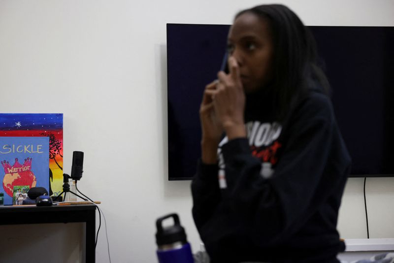 &copy; Reuters. A view of paintings related to sickle cell on a table as Dominique Goodson, who has sickle cell and advocates for awareness about the disease, takes a phone call in her room at her home in the Brooklyn borough of New York City, New York, U.S., August 6, 2