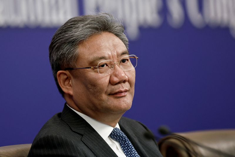 © Reuters. FILE PHOTO: Chinese Commerce Minister Wang Wentao attends a press conference on the sidelines of the National People's Congress (NPC), in Beijing, China March 6, 2024. REUTERS/Tingshu Wang/File Photo