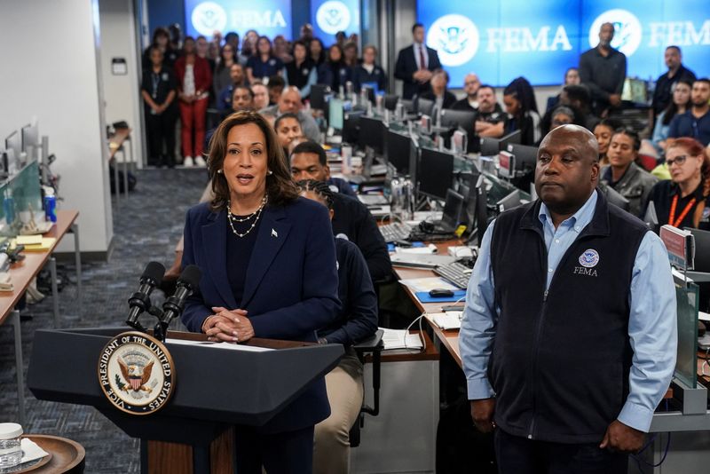 &copy; Reuters. FILE PHOTO: Democratic presidential nominee and U.S. Vice President Kamala Harris speaks next to FEMA Deputy Administrator Erik Hooks as she visits Federal Emergency Management Agency (FEMA) headquarters to receive a briefing on damage to North Carolina f