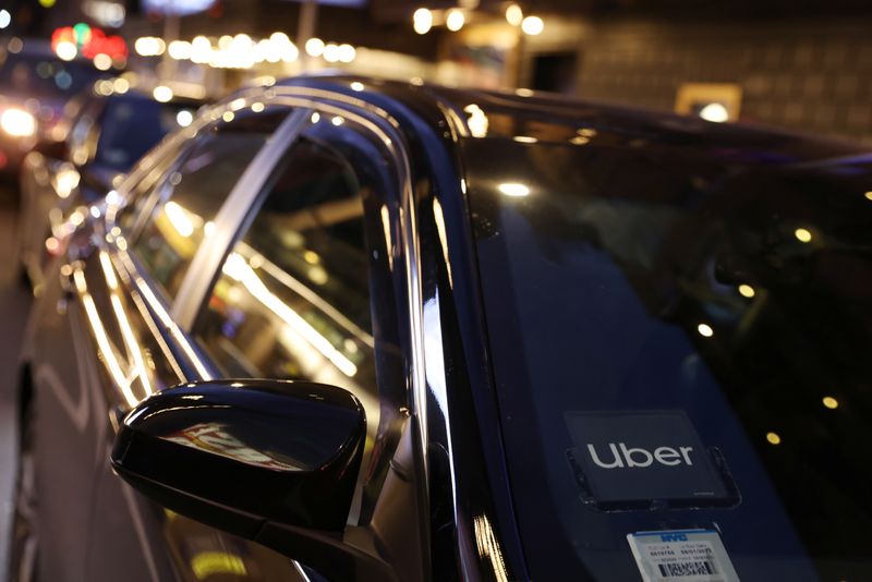 &copy; Reuters. The logo for Uber Technologies is seen on a vehicle in Manhattan, New York City, New York, U.S., November 17, 2021. REUTERS/Andrew Kelly/File Photo