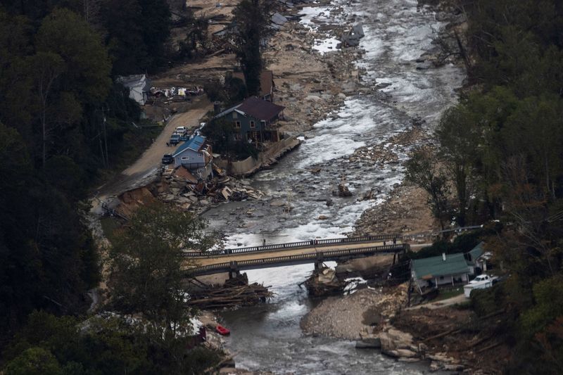 &copy; Reuters. FILE PHOTO: A residential area is destroyed by the Broad River following the passing of Hurricane Helene, in Bat Cave, North Carolina, U.S., October 3, 2024. REUTERS/Eduardo Munoz/File Photo