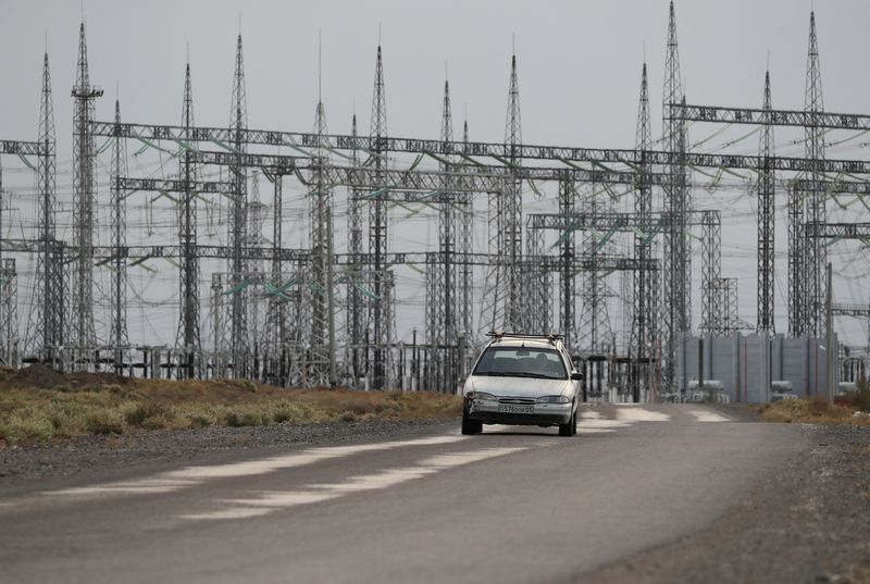 &copy; Reuters. A car drives near an electrical substation outside the village of Ulken on the eve of the referendum on the construction of a nuclear power plant, in the Almaty Region, Kazakhstan October 5, 2024. The village of Ulken was selected as the most preferred lo