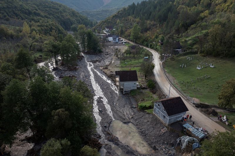 Bosnian villagers sift through ruined homes after devastating flash floods